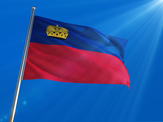 Liechtenstein National Flag Waving on pole against deep blue sky background. High Definition