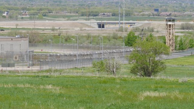 State prison boundary with guard tower.