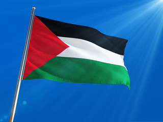 Palestine National Flag Waving on pole against deep blue sky background. High Definition