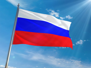 Fototapeta na wymiar Russia National Flag Waving on pole against sunny blue sky background. High Definition