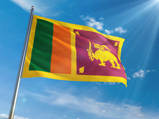 Sri Lanka National Flag Waving on pole against sunny blue sky background. High Definition