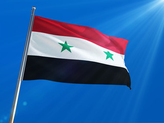 Fototapeta na wymiar Syria National Flag Waving on pole against deep blue sky background. High Definition