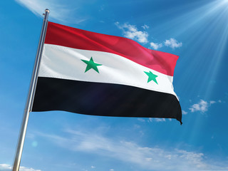 Fototapeta na wymiar Syria National Flag Waving on pole against sunny blue sky background. High Definition