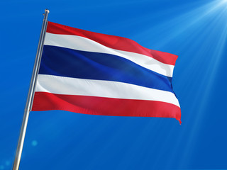 Fototapeta na wymiar Thailand National Flag Waving on pole against deep blue sky background. High Definition