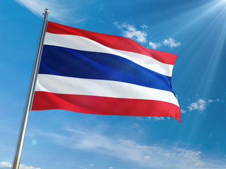 Thailand National Flag Waving on pole against sunny blue sky background. High Definition