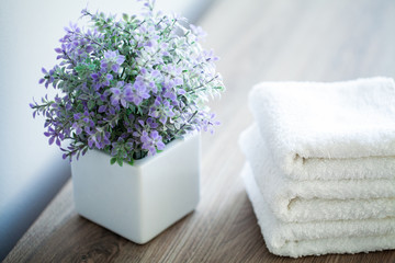 Fototapeta na wymiar Spa. White Cotton Towels Use In Spa Bathroom. Towel Concept. Photo For Hotels and Massage Parlors. Purity and Softness. Towel Textile