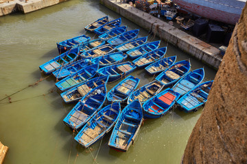 Lots of blue fishing boats in the port of Essaouira