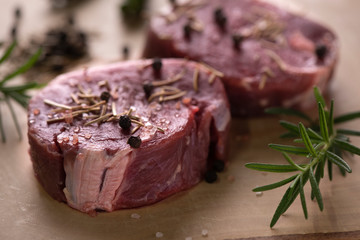 Fresh raw Prime Black Angus beef steaks on wooden board: Tenderloin, Denver Cut, Striploin, Rib Eye