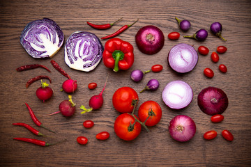 red vegetables set on wooden background