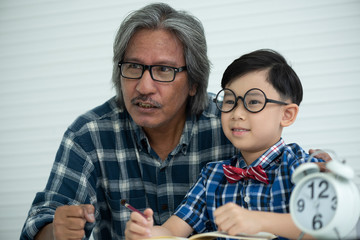 family concept, Father teaches homework, son