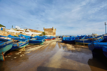 Fototapeta na wymiar Blue fishing boats in the port of Essaouira