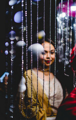 waist up picture of a girl wearing traditional wear during a wedding night event.