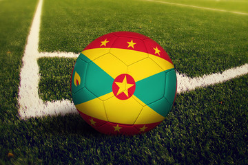 Grenada ball on corner kick position, soccer field background. National football theme on green...