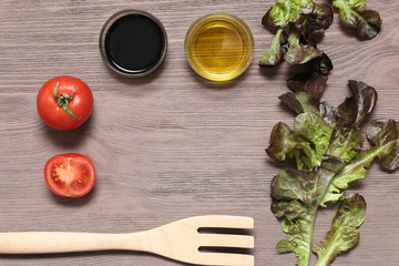 Salad mozzarella cheese tomatoes balsamic vinegar olive oil on a wooden board. Fresh food for diet product