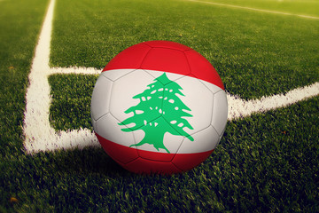 Lebanon ball on corner kick position, soccer field background. National football theme on green...