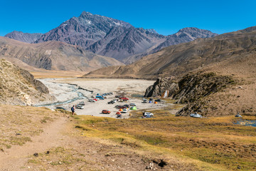 Trekking inside Andes valleys, central Chile at Cajon del Maipo, Santiago de Chile, amazing views over mountains, rivers and glaciers with an awesome hiking inside a rugged beautiful landscape