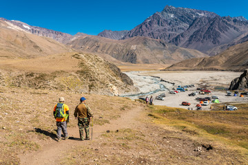 Trekking inside Andes valleys, central Chile at Cajon del Maipo, Santiago de Chile, amazing views over mountains, rivers and glaciers with an awesome hiking inside a rugged beautiful landscape