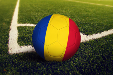 Romania ball on corner kick position, soccer field background. National football theme on green...