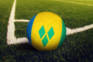 Saint Vincent And The Grenadines ball on corner kick position, soccer field background. National football theme on green grass.