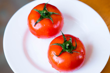 tomato on plate on the table