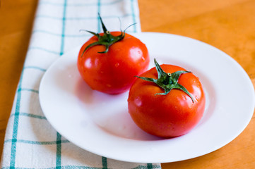 tomato on a towel on plate on the table