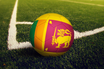Sri Lanka ball on corner kick position, soccer field background. National football theme on green grass.