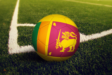 Sri Lanka ball on corner kick position, soccer field background. National football theme on green...