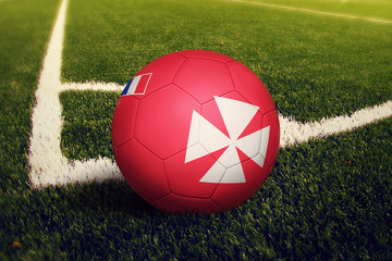 Wallis And Futuna ball on corner kick position, soccer field background. National football theme on green grass.