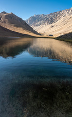 Fototapeta premium Los Patos Lagoon at Central Andes mountain range an amazing representation of the typical awe Andean landscape at Chile with amazing views over the highest southern 6,000m mountain Cerro Marmolejo