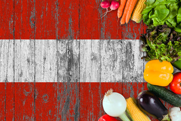 Fresh vegetables from Austria on table. Cooking concept on wooden flag background.
