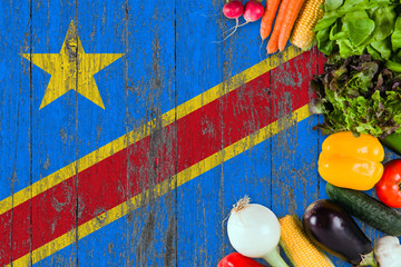 Fresh vegetables from Congo on table. Cooking concept on wooden flag background.