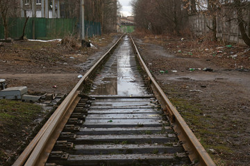 abandoned railway line extending into the distance