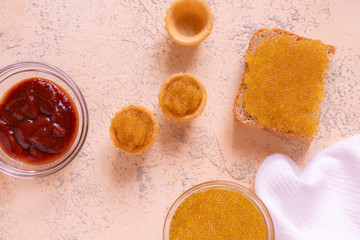 close up tartlets filled with fresh fish caviar, menu in expensive restaraunt concepts