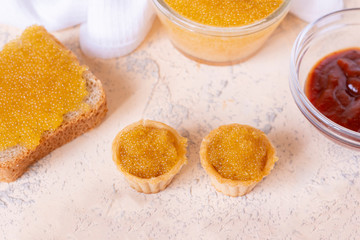 close up tartlets filled with fresh fish caviar, menu in expensive restaraunt concepts