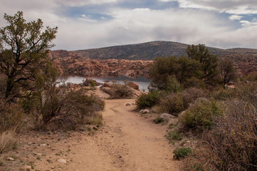 A dirt walking path to Watson Lake in Prescott, Arizona, USA on a sunny spring day