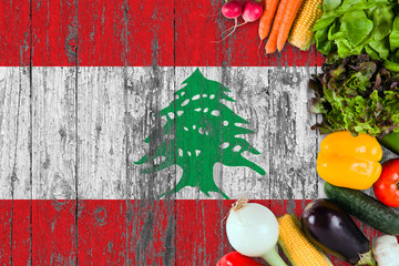 Fresh vegetables from Lebanon on table. Cooking concept on wooden flag background.