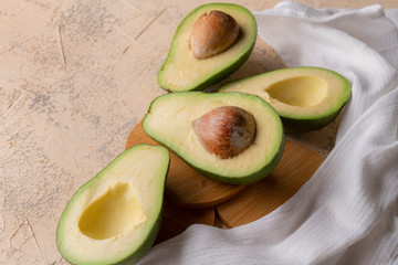 fresh organic sliced in a half avocado flat lay on the table isolated