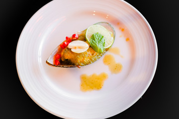 Mussels toping galic and lemon, fusion food