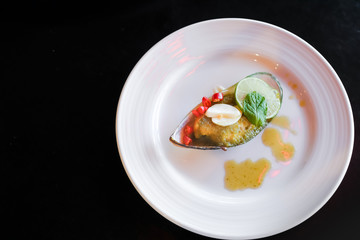 Mussels toping galic and lemon, fusion food