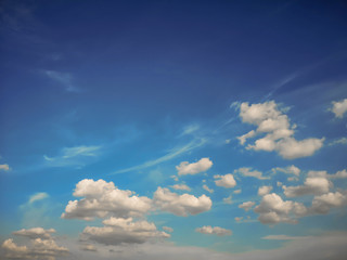 Deep blue sky and white cloud background.