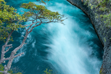 An amazing landscape at north Chilean Patagonia, Petrohue river moves around the volcanic lava...
