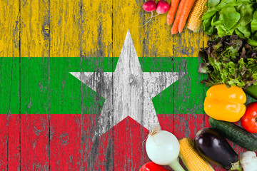 Fresh vegetables from Myanmar on table. Cooking concept on wooden flag background.
