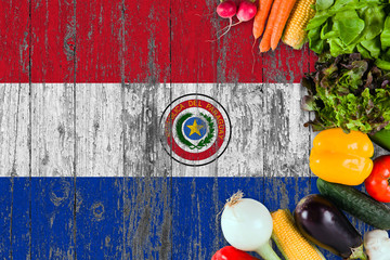 Fresh vegetables from Paraguay on table. Cooking concept on wooden flag background.