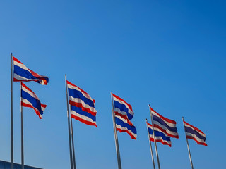 National flags of Thailand and blue sky background. Picture of waving Thai flag of Thailand in blue background.