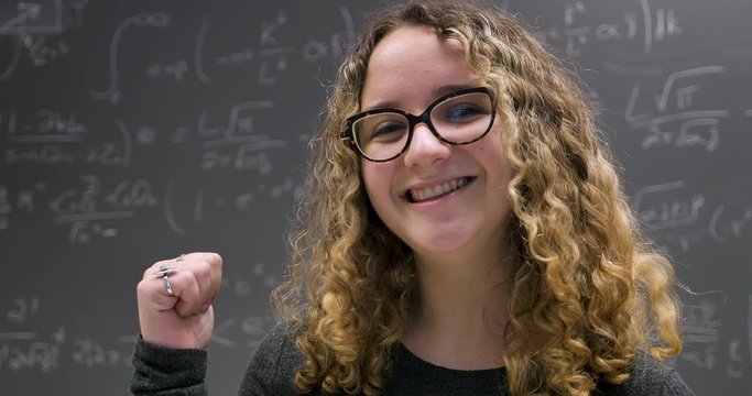 Young smart woman proud of her achievements solving a complex problem