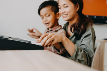 happy harmonious family concept.mother and son have activities together on holidays.