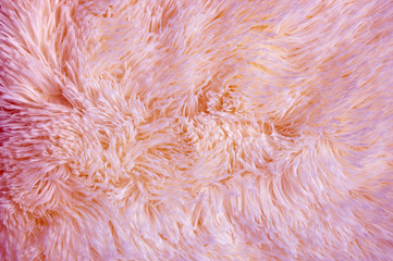 Pink colored fluffy fake fur texture