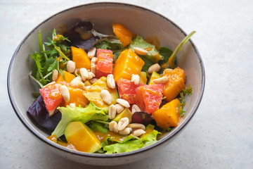 Healthy salad with mango grapefruit and avokado for light and nutricios breakfast