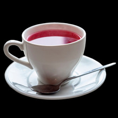 Cup of tea on a window isolated on black