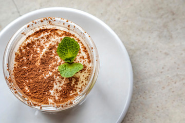 Tiramisu dessert with a mint leaves on top